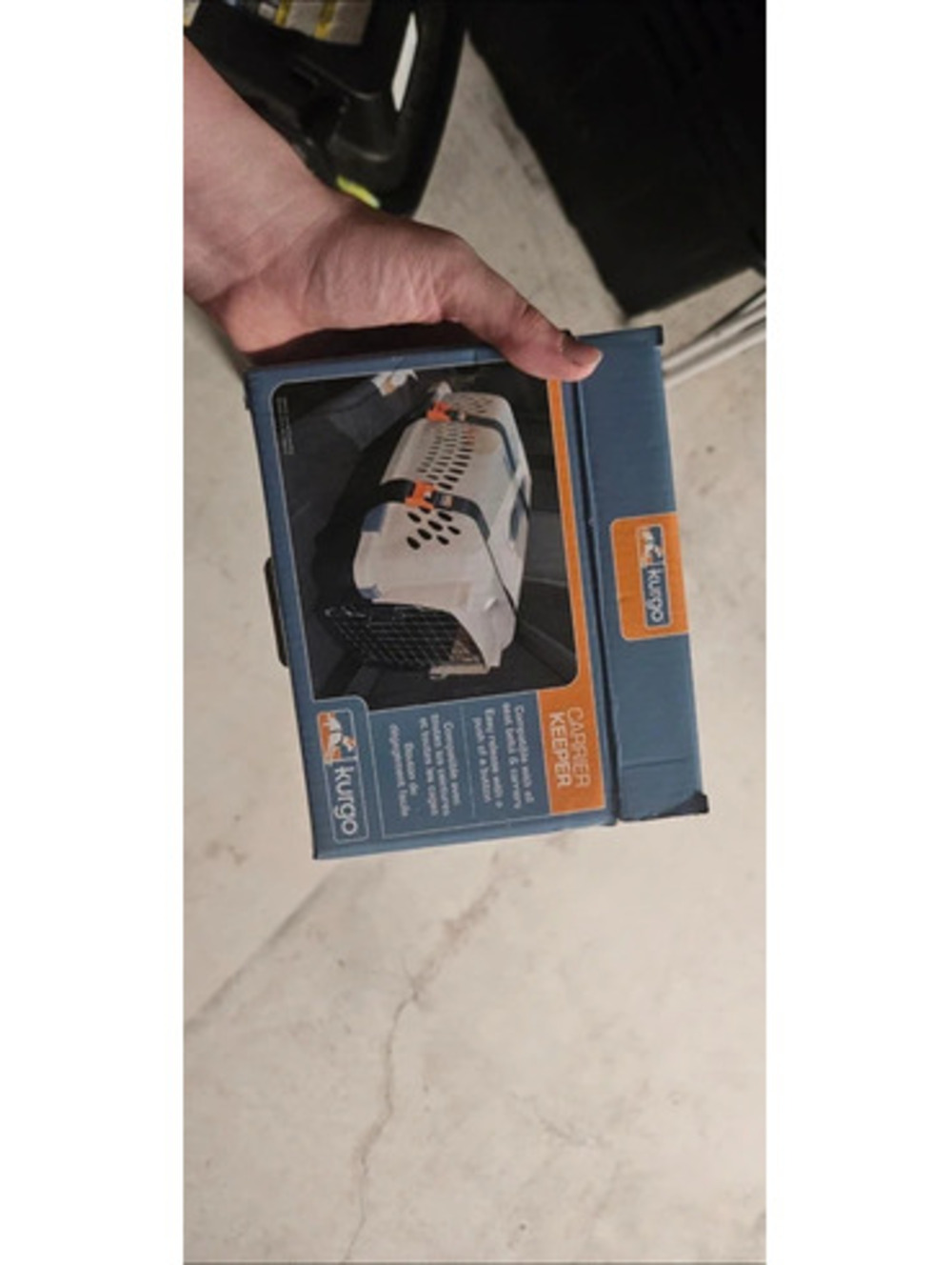 Carrier keeper device to secure a pet crate in your car